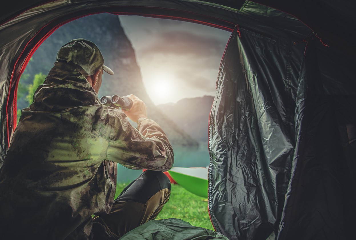 hunter-watching-prey-from-tent