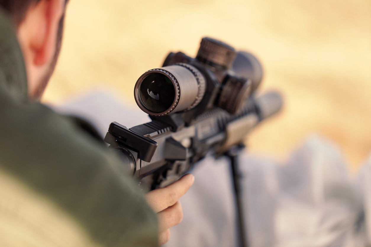  looking-through-scope-of-ar-15-rifle